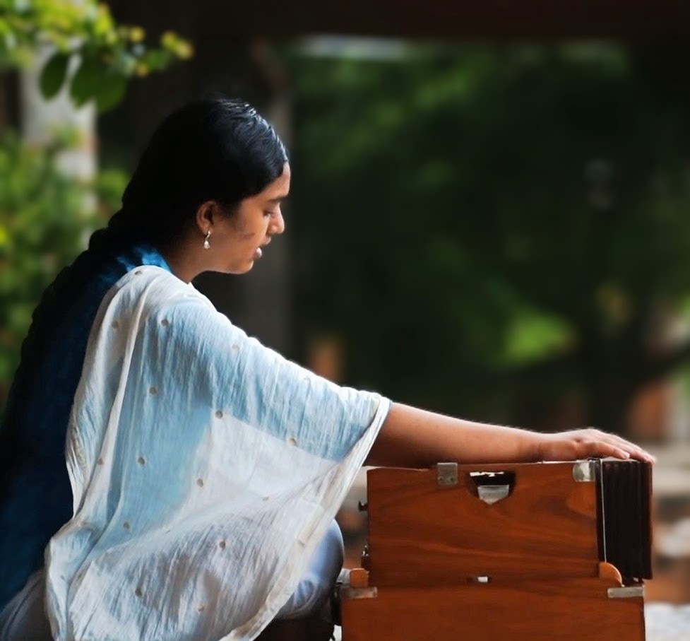 Hindustani vocalist singing with a harmonium
